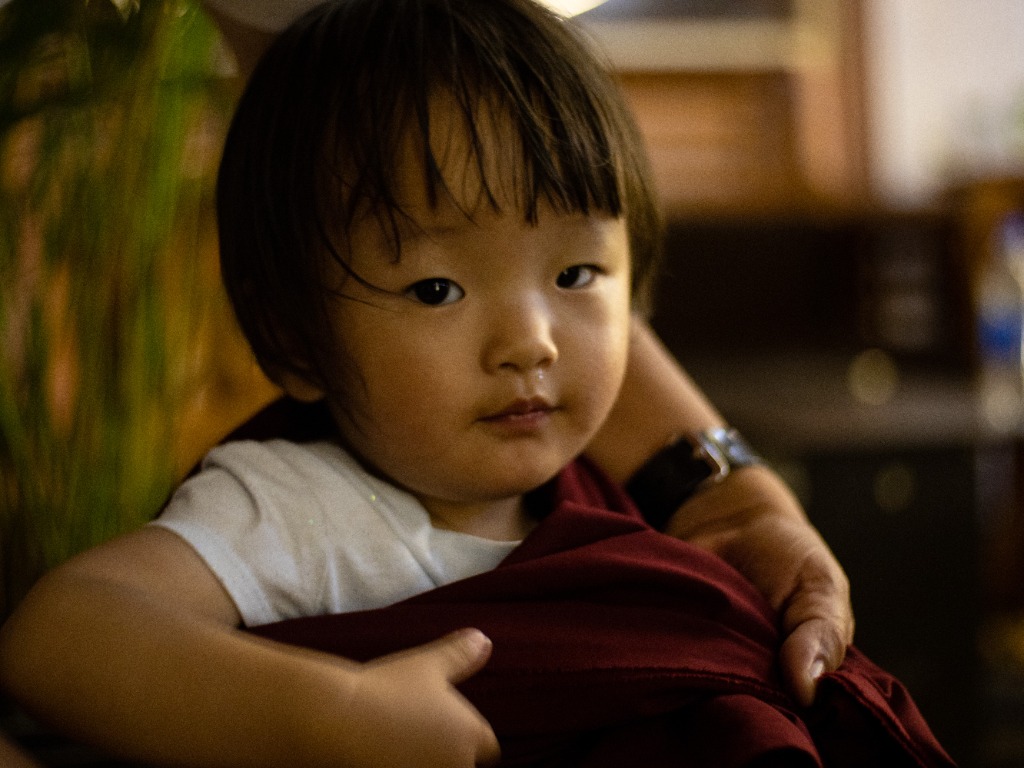 Child monk close-up portrait