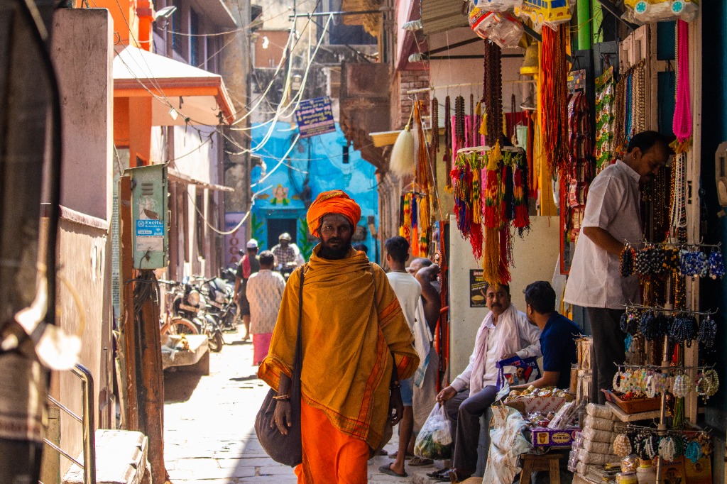 Sadhu walking in street market