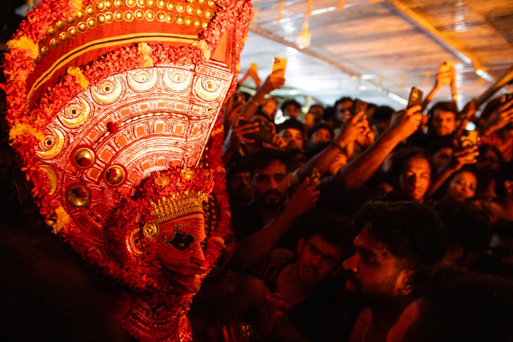 Theyyam performer close-up with elaborate headdress