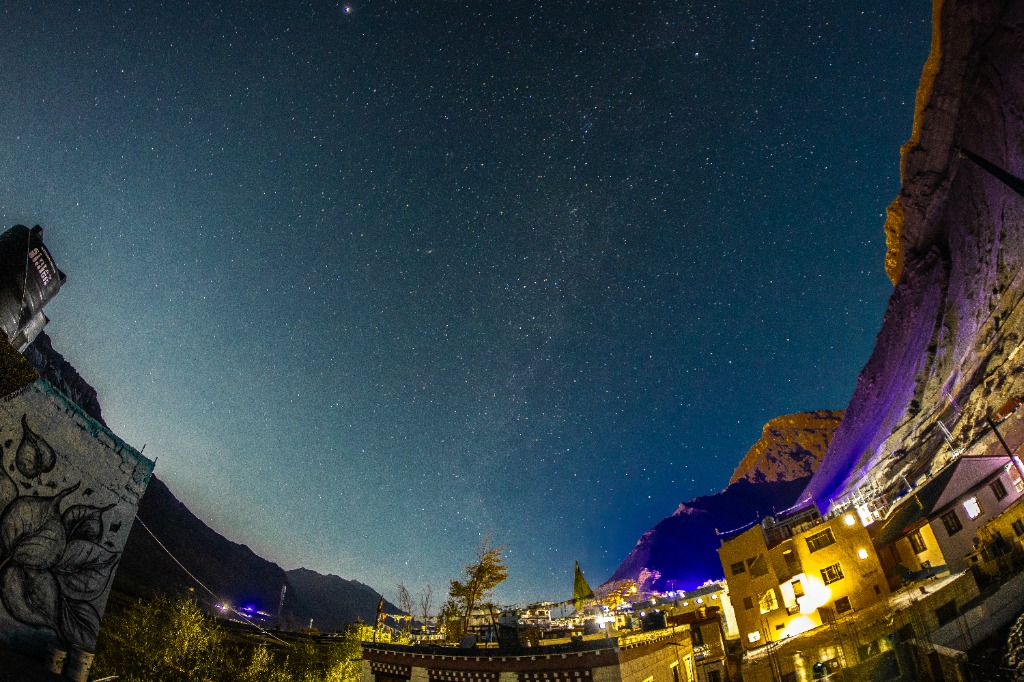 Stunning starry night sky over mountain valley